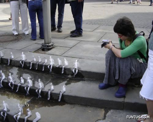 Ice Sculptures of Melting Men